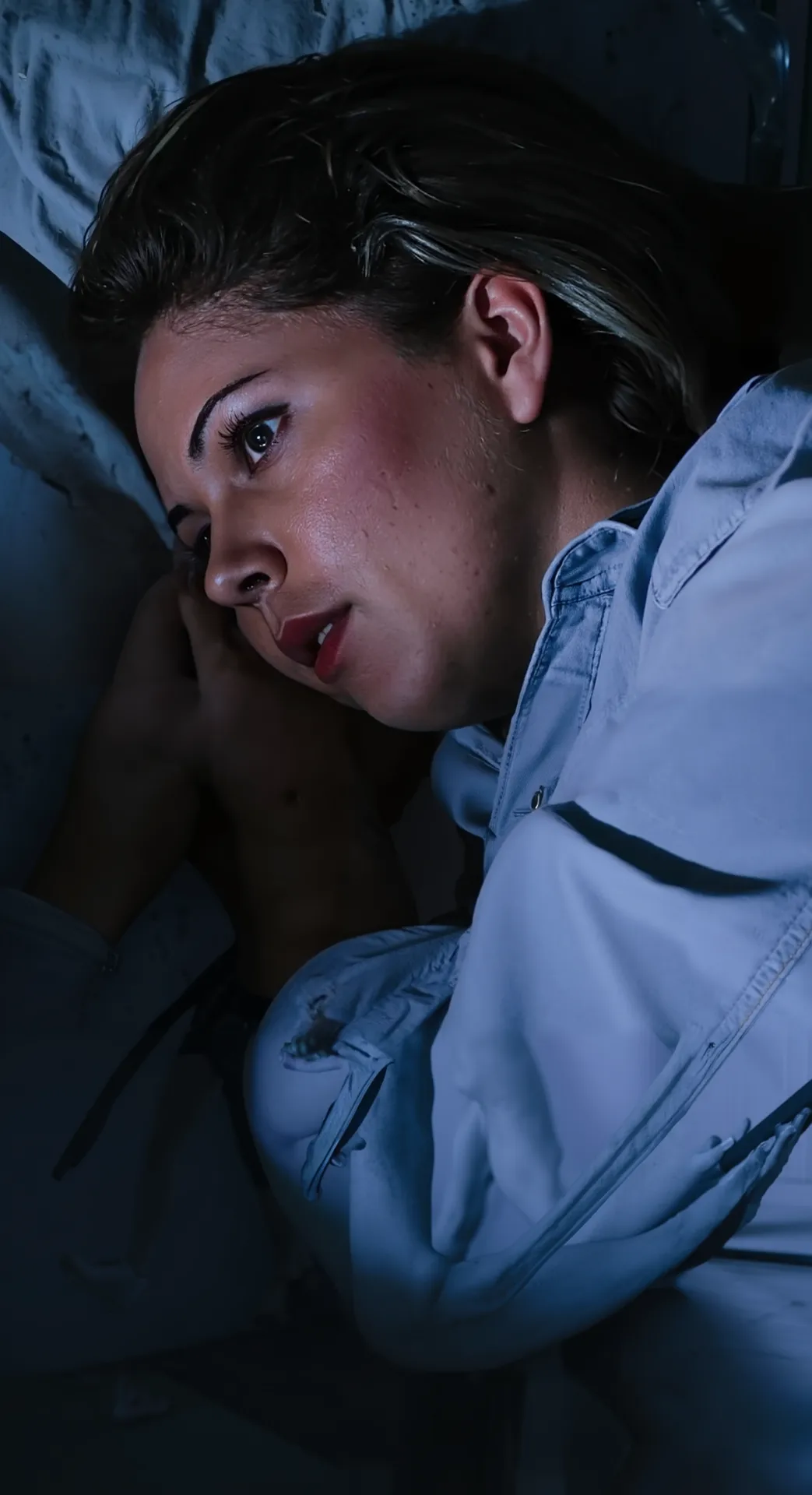 woman struggling to sleep lying awake in bed